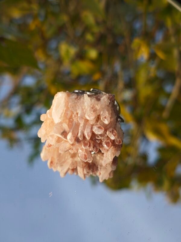 Pink crystal ring. It appears pale pink to the naked eye