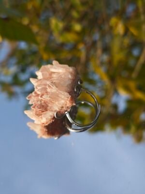 Pink crystal ring. It appears pale pink to the naked eye