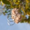 Pink crystal ring. It appears pale pink to the naked eye